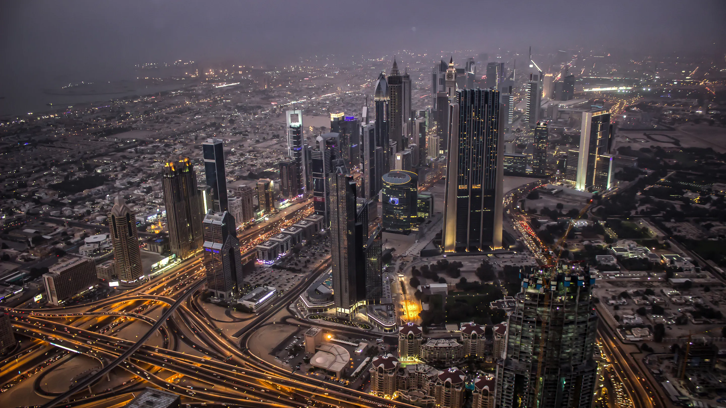 A meeting at dusk against a city skyline