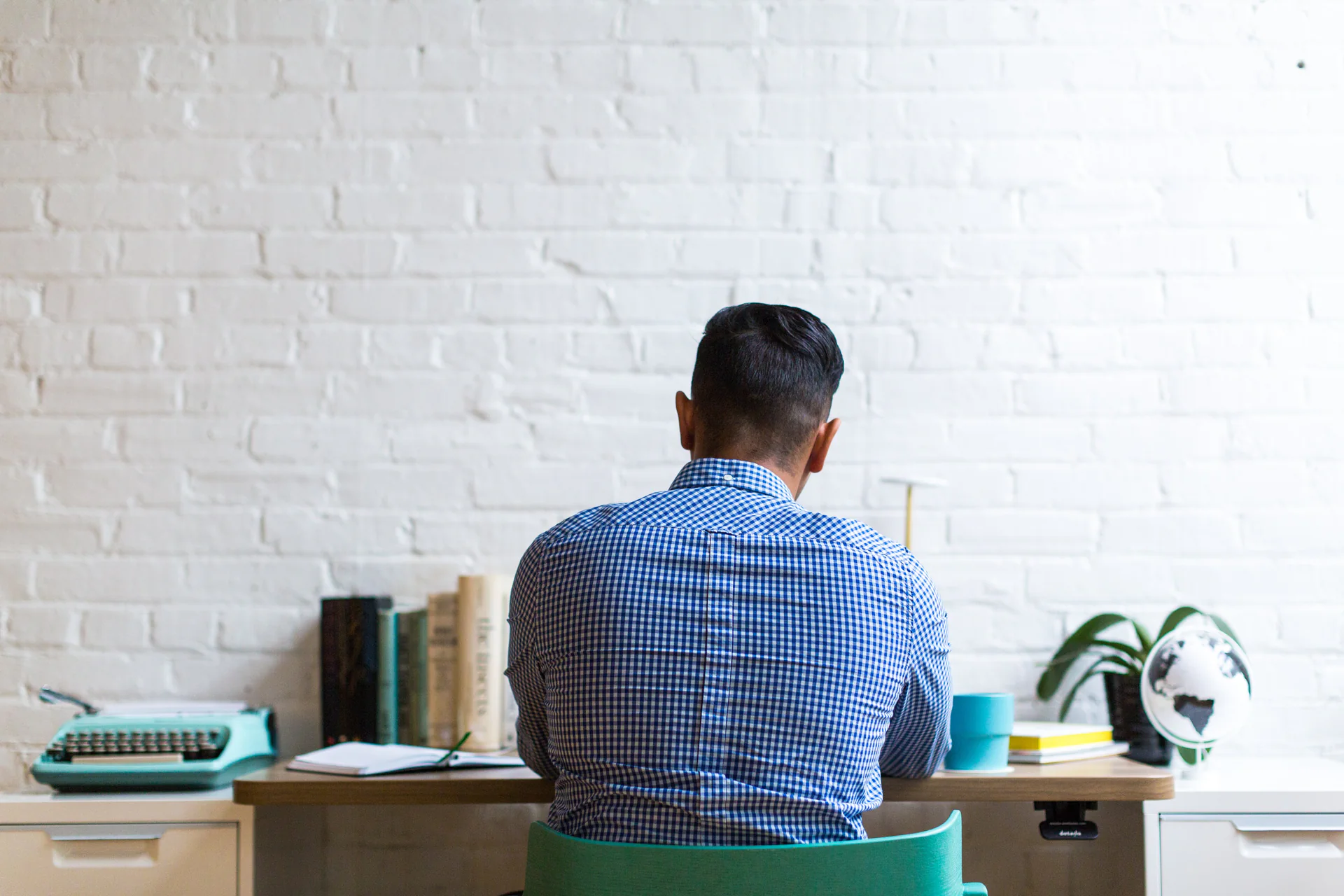 A professional working through a report at a desk
