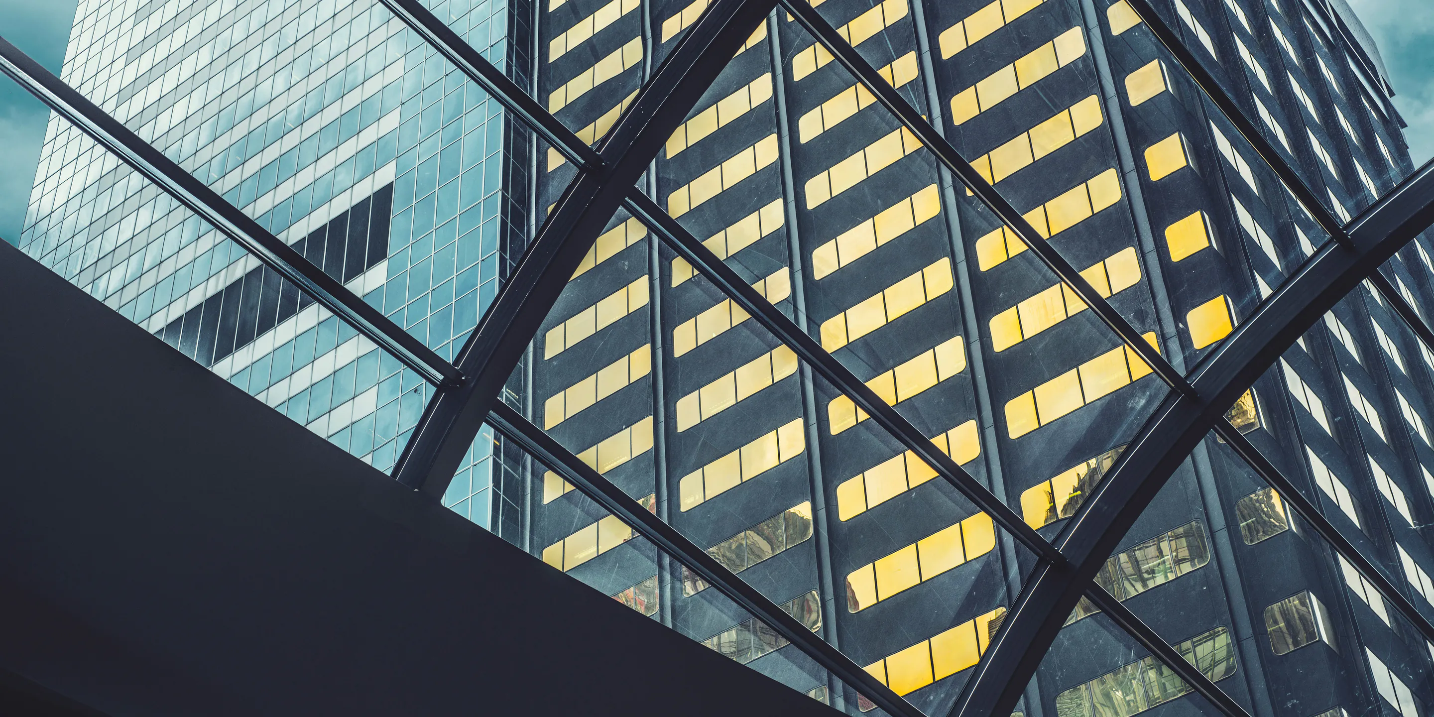 The glass facade of an office tower